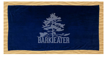 Our dark navy blue 100% ringspun cotton beach towels features the Bark Eater Outfitters logo in light tone horizontally. The eastern white pine is abundant in the Adirondacks