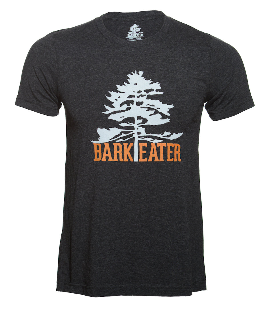 Centered on the chest of a charcoal grey triblend tee shirt is Bark Eater Outfitters logo. An eastern white pine in light grey with Bark Eater at the base of the tree in burnt orange. The trunk of the tree seperates Bark and Eater