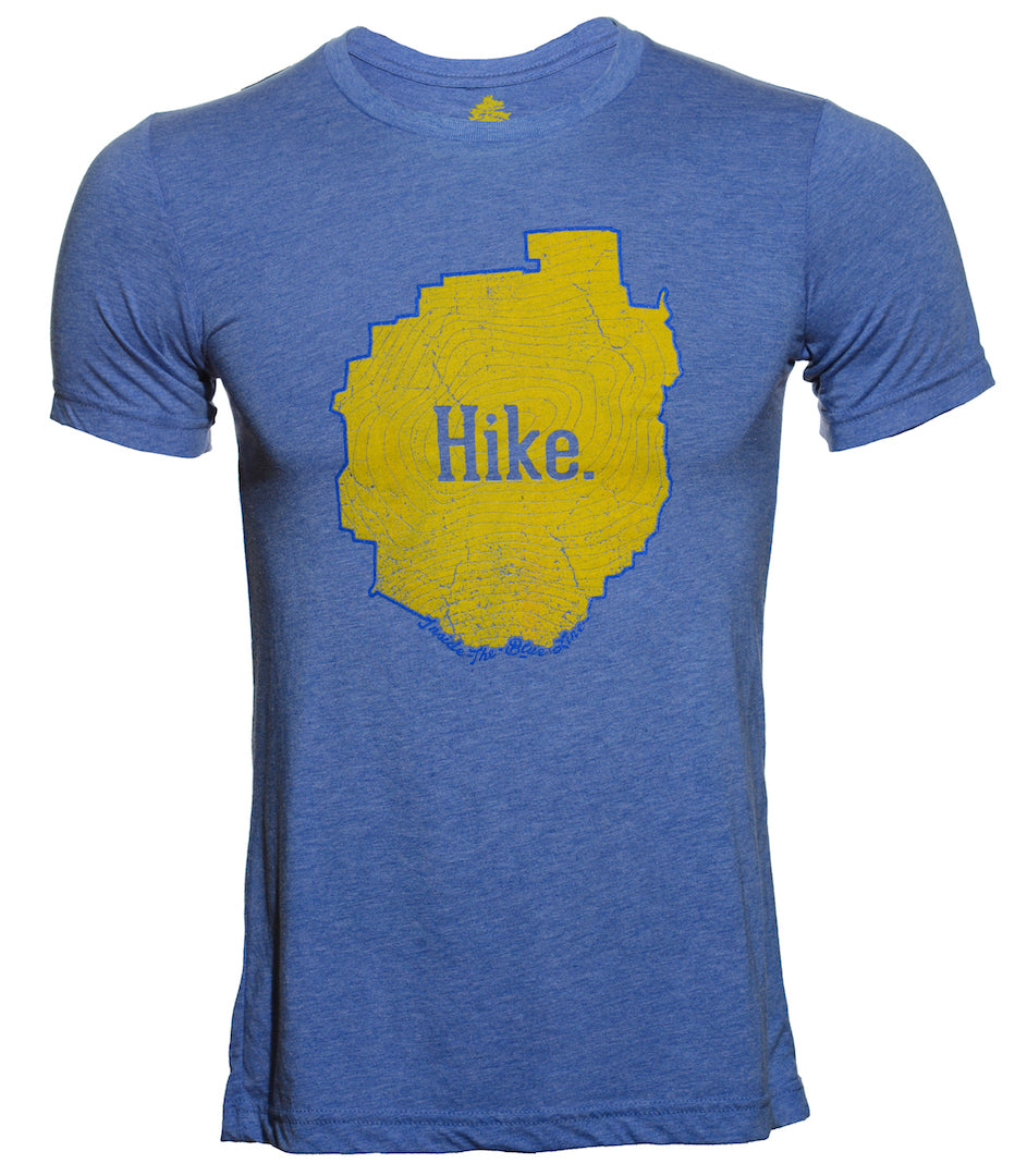 An incredibly soft unisex Blue triblend tee shirt with the outline of the Adirondack Park in blue ink. Inside the blue line is a yellow topographic map of Mt Marcy, New York's highest peak, with the word Hike centered on the front of the tee. 